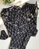 PIJAMA PANTALON MANGA LARGA NEGRO FLORES BLANCAS
